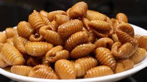 Traditional Homemade Bellam Gavvalu made with jaggery – sweet shell-shaped Indian snack