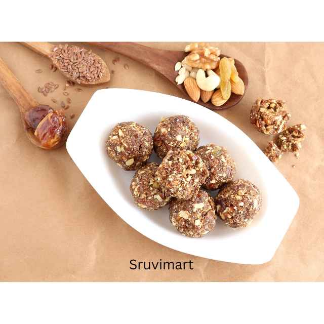 Homemade Dry Fruit Laddu made with almonds, dates, and cashews in eco-friendly box.